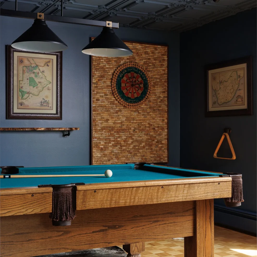 Games room with navy walls, painted coffered ceiling, oak pool table and cork dartboard wall, 10 Mile Point renovation by Maverick Design, Victoria BC