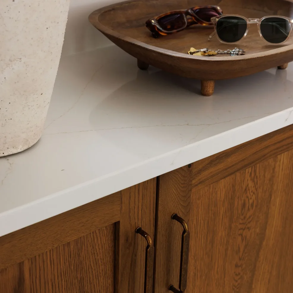 Oak Shaker cabinet with aged brass pulls and quartz counter in the mudroom, 10 Mile Point renovation by Maverick Design, Victoria BC